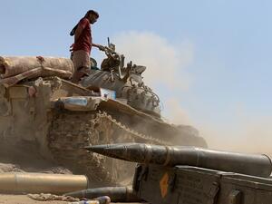 A fighter loyal to Yemen's separatist Southern Transitional Council (STC) stands atop a tank amid clashes with Saudi-backed government forces for control of Zinjibar, the capital of the southern Abyan province, in the Sheikh Salim area on May 23, 2020. Nabil HASAN / AFP