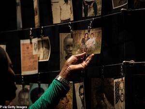 A visitor looking at victims' portraits at the Kigali Genocide Memorial in Kigali, Rwanda. (AFP/ File Photo)