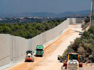 Near the Rosh Hanikra border crossing in northern Israel, shows tractors along a new wall on the Israeli-Lebanese border. AFP Near the Rosh Hanikra border crossing in northern Israel, shows tractors along a new wall on the Israeli-Lebanese border. AFP