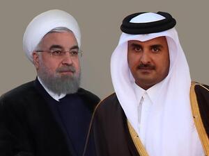 الرئيس الإيراني حسن روحاني وأمير قطر تميم بن حمد