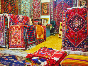 Watch the colorful Persian carpets in Vakil Bazaar of Shiraz, these are traditional goods and gifts from Iran (Shutterstock)
