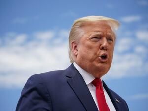 US President Donald Trump speaks to the press before boarding Air Force One as he departs from Joint Base Andrews in Maryland on May 30, 2020. Trump travels to Kennedy Space Center in Florida to watch the launch of the manned SpaceX Demo-2 mission to the International Space Station. MANDEL NGAN / AFP