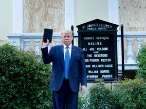 US President Donald Trump holds a Bible while visiting St. John's Church across from the White House after the area was cleared of people protesting the death of George Floyd June 1, 2020, in Washington, DC. US President Donald Trump was due to make a televised address to the nation on Monday after days of anti-racism protests against police brutality that have erupted into violence. The White House announced that the president would make remarks imminently after he has been criticized for not publicly addr