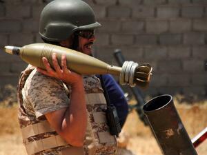 A fighter loyal to the UN-recognised Libyan Government of National Accord (GNA) holds a mortar shell amid clashes with rival forces loyal to strongman Khalifa Haftar near the capital Tripoli International Airport, on June 3, 2020. (AFP)