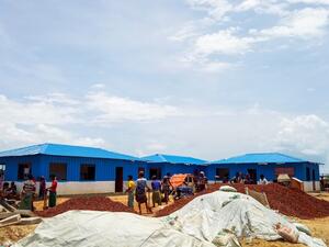 Rohingya refugees work to build a quarantine centre at the Kutupalong refugee camp in Ukhia on June 4, 2020. Rohingya refugees are so fearful of failing coronavirus tests that they have fled isolation centres in camps in Bangladesh where the first death of one of the Muslim outcasts has heightened nerves over the spread of the pandemic, according to community leaders. About one million Rohingya, most of whom fled a military crackdown in Myanmar in 2017, are packed into camps along the Bangladesh border wher