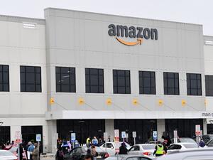 In this file photo taken on March 30, 2020, Amazon workers at Amazon's Staten Island warehouse strike in demand that the facility be shut down and cleaned after one staffer tested positive for the coronavirus in New York. (AFP/File)