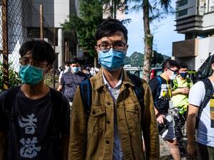 Local politician Ventus Lau (C) leaves the Eastern District Court in Hong Kong on June 10, 2020, after appearing in court on charges of illegally entering the Legislative Council government complex during protests on July 1, 2019. Hong Kong prosecutors on June 10 slapped additional riot charges against a group of prominent pro-democracy figures who allegedly joined crowds that broke into the city's legislature in 2019, increasing their potential jail sentence to a decade. Anthony WALLACE / AFP