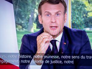 French President Emmanuel Macron is seen on a television screen in Paris on June 14, 2020 as he addresses the nation from the Elysee Palace during a televised speech, broadcast by French tv channel TF1. Thomas SAMSON / AFP