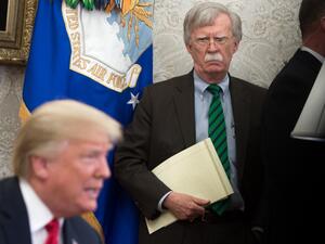 In this file photo National Security Adviser John Bolton stands alongside US President Donald Trump as he speaks during a meeting with NATO Secretary General Jens Stoltenberg in the Oval Office of the White House in Washington, DC, May 17, 2018. SAUL LOEB / AFP