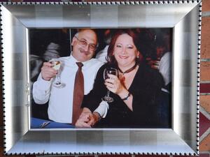 A picture shows a family photograph of Anoosheh Ashoori (L) and wife Sherry Izadi (R), seen during an interview with AFP in London on June 19, 2020. The sound is a little fuzzy but Anoosheh Ashoori's voice does not falter as he delivers his message to British Prime Minister Boris Johnson from inside Iran's Evin jail. DANIEL LEAL-OLIVAS / AFP A picture shows a family photograph of Anoosheh Ashoori (L) and wife Sherry Izadi (R), seen during an interview with AFP in London on June 19, 2020. The sound is a little fuzzy but Anoosheh Ashoori's voice does not falter as he delivers his message to British Prime Minister Boris Johnson from inside Iran's Evin jail. DANIEL LEAL-OLIVAS / AFP