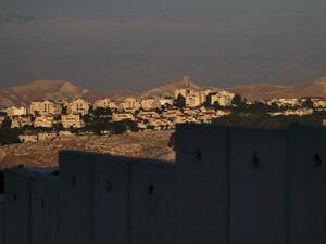 A picture taken from east Jerusalem behind Israel's controversial separation barrier shows the Israeli settlement of Maale Adumim in the occupied West Bank on June 22, 2020. AHMAD GHARABLI / AFP
