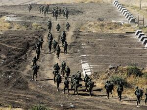 Israeli army soldiers take part in a military drill in the Israeli-annexed Golan Heights on June 24, 2020. JALAA MAREY / AFP