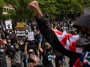 Demonstrators gather to protest the recent death of George Floyd on May 31, 2020 in Seattle, Washington. Protests due to the recent death of George Floyd took place in Seattle and its suburb of Bellevue, with looting in Bellevue and at least one burned automobile there. David Ryder/Getty Images/AFP David Ryder / GETTY IMAGES NORTH AMERICA / Getty Images via AFP