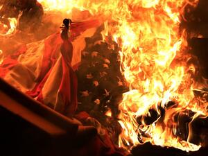 A U.S. flag burns during a protest near the White House in response to the killing of George Floyd May 31, 2020 in Washington, DC. Former Minneapolis police officer Derek Chauvin was fired then arrested for Floyd's death and is accused of killing Floyd by kneeling on his neck. Chauvin and three other officers, Tou Thao, J Alexander Kueng and Thomas K. Lane, were involved in Floyd's arrest on an accusation of "forgery-in-progress". Alex Wong/Getty Images/AFP ALEX WONG / GETTY IMAGES NORTH AMERICA / Getty Images via AFP A U.S. flag burns during a protest near the White House in response to the killing of George Floyd May 31, 2020 in Washington, DC. Former Minneapolis police officer Derek Chauvin was fired then arrested for Floyd's death and is accused of killing Floyd by kneeling on his neck. Chauvin and three other officers, Tou Thao, J Alexander Kueng and Thomas K. Lane, were involved in Floyd's arrest on an accusation of "forgery-in-progress". Alex Wong/Getty Images/AFP ALEX WONG / GETTY IMAGES NORTH AMERICA / Getty Ima