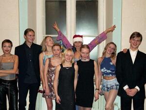 Ekaterina and Maria Putina (pictured in the centre) surrounded by members of Russian pop group Strelki in the early 2000s (Twitter)