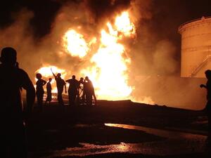 Fire blazes from the Aden oil refinery following a reported shelling attack by Houthi rebels in the embattled southern Yemeni city of Aden on July 13, 2015 [SALEH AL-OBEIDI/AFP/Getty Images]