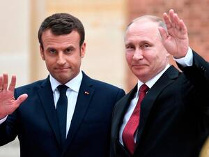 French President Emmanuel Macron with Russian leader Vladimir Putin. AFP