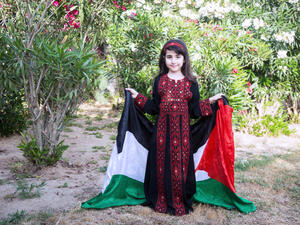 A Palestinian little girl wears a traditional dress. (Shutterstock/ File Photo)