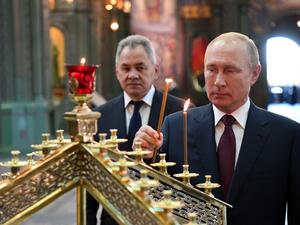Russian President Vladimir Putin, accompanied by Defence Minister Sergei Shoigu, visits the Cathedral of the Armed Forces in a military theme park outside Moscow on June 22, 2020. Alexey NIKOLSKY / SPUTNIK / AFP