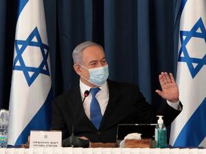 Israeli Prime Minister Benjamin Netanyahu wears a protective mask as he opens the weekly cabinet meeting at the foreign ministry in Jerusalem on July 5, 2020. GALI TIBBON / POOL / AFP