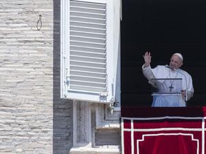 Pope Francis addresses the crowd from the window of the apostolic palace overlooking Saint Peter's square during his Sunday Angelus prayer on July 5, 2020. Tiziana FABI / AFP