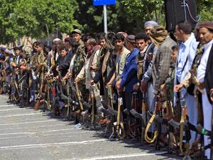 Yemeni gunmen loyal to the Huthi movement brandish their weapons during a gathering in the capital Sanaa, to show support to the movement against the Saudi-led intervention in the country on July, 7, 2020. MOHAMMED HUWAIS / AFP