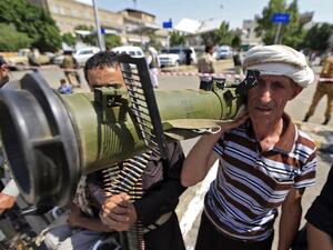 A Yemeni gunman loyal to the Huthi movement brandishes an anti-tank weapon during a rally in the capital Sanaa, to show support to the movement against the Saudi-led intervention in the country on July, 7, 2020. Mohammed HUWAIS / AFP