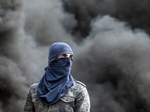 A Palestinian demonstrator is pictured during clashes following the funeral of 29-year-old Palestinian Ibrahim Abou Yacoub, who was killed by Israeli forces, in the village of Kifl Hares, south of the West Bank city of Nablus on July 10, 2020. Israeli troops killed a Palestinian civilian in the West Bank on July 9, the Palestinian health ministry said. The ministry did not give any details as to the circumstances of the killing, stating only that "a civilian was killed by Israeli forces" after being shot in