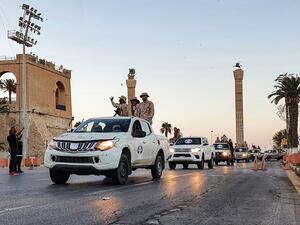 Vehicles of the "Tripoli Brigade", a militia loyal to the UN-recognised Government of National Accord (GNA), parade through the Martyrs' Square at the centre of the GNA-held Libyan capital Tripoli on July 10, 2020. Mahmud TURKIA / AFP