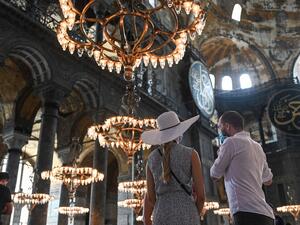 Tourists visit the inside of Hagia Sophia on July 10, 2020, in Istanbul, before a top Turkish court revoked the sixth-century Hagia Sophia's status as a museum, clearing the way for it to be turned back into a mosque. (AFP)