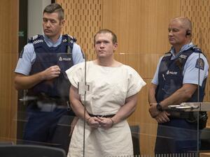 This file picture taken on March 16, 2019 shows Brenton Tarrant (C), the man charged in relation to the Christchurch massacre, standing in the dock during his appearance at the Christchurch District Court. Australian national Brenton Tarrant, the gunman behind New Zealand's Christchurch mosque shootings, sacked his lawyers on July 13, 2020 and opted to represent himself, raising fears he would use a sentencing hearing next month to promote his white-supremacist views. Mark Mitchell / POOL / AFP