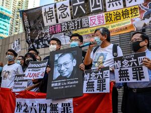 Supporters and activists, who led the June 4 candlelight vigil which commemorates the 1989 Tiananmen Square crackdown in Beijing, shout slogans before attending a mention at the West Kowloon Magistrates Court in Hong Kong on July 13, 2020. (AFP/File) Supporters and activists, who led the June 4 candlelight vigil which commemorates the 1989 Tiananmen Square crackdown in Beijing, shout slogans before attending a mention at the West Kowloon Magistrates Court in Hong Kong on July 13, 2020. (AFP/File)