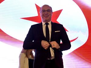 Tunisian Prime Minister Elyes Fakhfakh arrives to preside over the national conference "to establish decentralisation and local power" on July 15, 2020 in Tunis. The Islamist party Ennahdha has withdrawn its trust from the Fakhfakh government. The resignation of the head of government, Elyes Fakhfakh, or the continuation of his office at the head of the government depends on the results of the audit committee's investigation into the conflict of interest scandal, which will be published on Friday 17.  FETHI