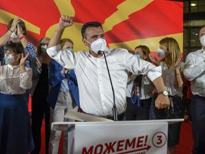 Zoran Zaev, leader of the ruling SDSM party, wears a facemask as he celebrates victory during general elections in Skopje early on July 16, 2020. North Macedonia's Social Democrats were locked in a tight battle for first place with nationalist rivals, preliminary results of elections showed, highlighting deep fault lines in the Balkan state. Robert ATANASOVSKI / AFP
