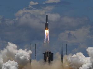 A Long March-5 rocket, carrying an orbiter, lander and rover as part of the Tianwen-1 mission to Mars, lifts off from the Wenchang Space Launch Centre in southern China's Hainan Province on July 23, 2020. Noel CELIS / AFP