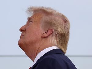 President Donald Trump watches as military aircraft perform a flyover near the White House on July 04, 2020 in Washington, DC. President Trump is hosting a "Salute to America" celebration that includes flyovers by military aircraft and a large fireworks display. Tasos Katopodis/Getty Images/AFP TASOS KATOPODIS / GETTY IMAGES NORTH AMERICA / Getty Images via AFP