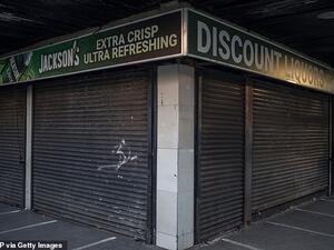 In this file photo taken on April 17, 2020 a closed liquor store is seen in Hillbrow, Johannesburg. South African reiterated on July 12, 2020 that the sale and export of alcohol in South Africa is forbidden as curfew was re-imposed as coronavirus infections spike. MARCO LONGARI / AFP