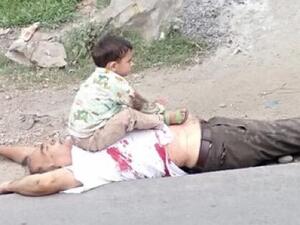The family of deceased Bashir Ahmed Khan alleged that he was dragged out of his car and shot dead by Indian paramilitary troopers. His three-year-old grandson, who was travelling with him, was later pictured sitting on his chest. (Twitter)