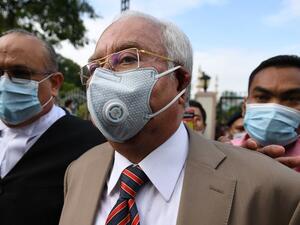 Malaysia's former prime minister Najib Razak (C) arrives at the Duta Court complex awaiting a verdict in his corruption trial in Kuala Lumpur, Malaysia on July 28, 2020.  MOHD RASFAN/AFP/GETTY IMAGES