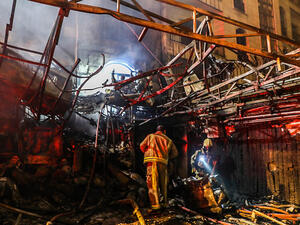Firemen search for survivors at the scene of an explosion at the Sina At'har health center north of Tehran on June 30, 2020. Photo: Amir Kholousi / ISNA / AFP