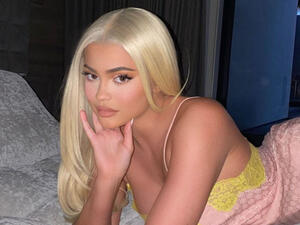 She had on the sleeveless gold dress,