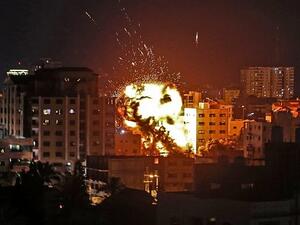 An explosion is seen among buildings during an Israeli airstrike on Gaza City in response to rocket fire from the Palestinian enclave on May 4, 2019. (Mahmud Hams/AFP)
