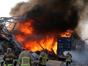 Lebanese media carried images of people trapped under rubble, some bloodied, after the massive explosions, the cause of which was not immediately known.  STR / AFP