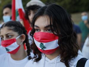 Lebanese come together for a vigil held at Kensington gardens in central London to honour the victims of the Beirut blast on August 5, 2020. Tolga Akmen / AFP