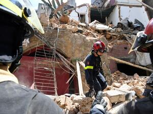 A French rescuer stands amidst the rubble of a building in the Gemayzeh neighbourhood on August 6, 2020, two days after a massive explosion in the Beirut port shook the capital. The blast caused massive destruction and killed at least 113 people, heaping misery on a country in crisis. AFP