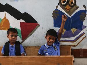 Palestinian students attend a class at a school run by the United Nations Relief and Works Agency (UNRWA) in Jabalia refugee camp in northern Gaza Strip, on the first day of school after local authorities eased some of the restrictions that were imposed in a bid to slow the spread of the novel coronavirus, on August 8, 2020. MAHMUD HAMS / AFP