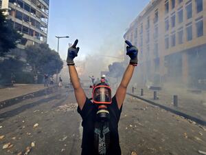 A Lebanese protester gives the middle finger to security forces during clashes in downtown Beirut on August 8, 2020, following a demonstration against a political leadership they blame for a monster explosion that killed more than 150 people and disfigured the capital Beirut. JOSEPH EID / AFP