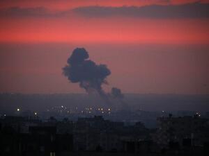 Smoke rises in the distance after war planes belonging to the Israeli army carried out airstrikes over Khan Yunis, in the Southern Gaza Strip early morning on August 21, 2020. Israeli planes launched raids against Gaza late on August 20 in response to rocket fire, security sources in the Palestinian enclave said, as mediators sought to broker an end to the latest flare-up.  SAID KHATIB / AFP