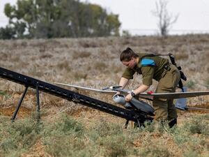 An Israeli soldier prepares an Elbit Systems Skylark I unmanned aerial vehicle (UAV or drone) for take-off near the border with the Gaza Strip in southern Israel on August 21, 2020, as part of monitoring operations in the area. JACK GUEZ / AFP