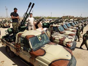 A file photo taken on June 18, 2020 shows members of the self-proclaimed eastern Libyan National Army (LNA) special forces gather in the city of Benghazi, on their way to reportedly back up fellow LNA fighters on the frontline west of the city of Sirte, facing forces loyal to the UN-recognised Government of National Accord (GNA). A surprise ceasefire announcement by Libya's rival administrations offers a glimmer of hope for peace, but analysts caution scepticism after years of violence and as multiple forei